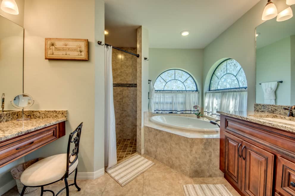 Master bathroom with bathtub and walk-in shower