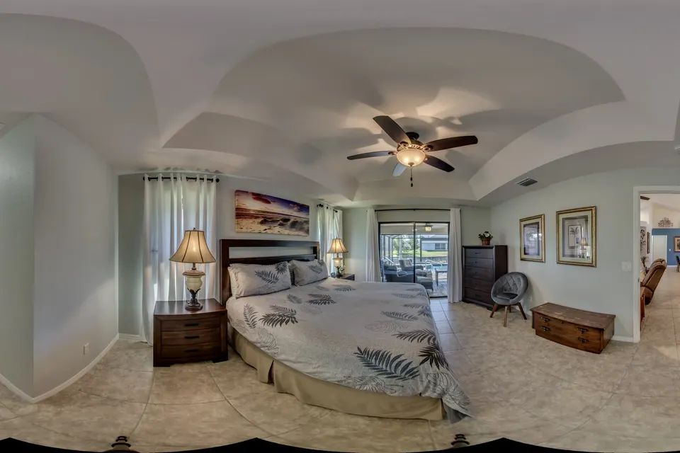 360° view of the master bedroom with bed, dresser and a hallway